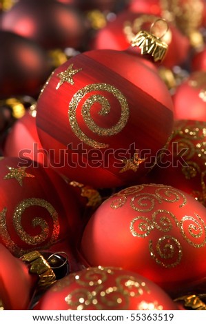 Festive red baubles with gold shimmering imprints