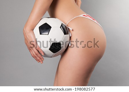 sexy female holding soccer ball