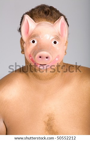 Young man wearing a pig mask
