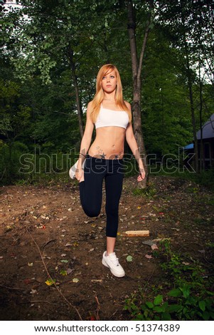 young woman running in the woods