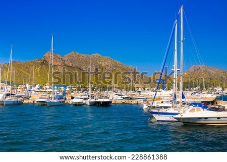 POLLENCA PORT, MAJORCA- AUG 22: Yacht and boats anchored in port on 22 August 2014 on Mallorca island.Many artists and celebrities chose Port de Pollenca as their home.
