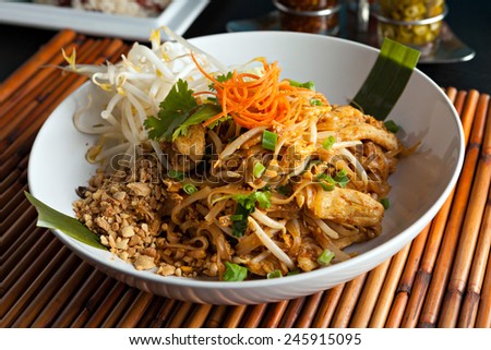 Chicken pad Thai dish of stir fried rice noodles with a contemporary presentation