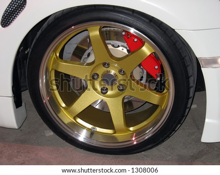 stock-photo-custom-gold-rims-on-a-white-sportscar-complete-with-performance-brakes-1308006.jpg