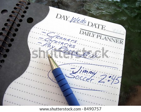 A daily planner filled with a busy parent\'s daily activities.