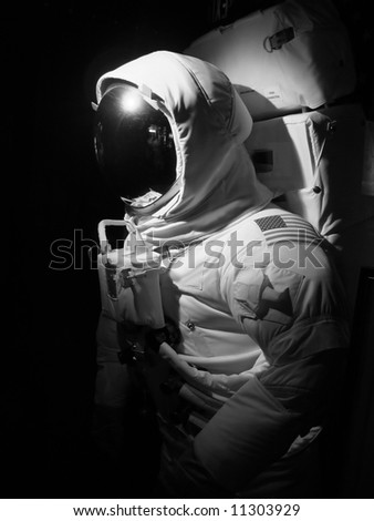 An astronaut set up under dramatic lighting - black and white.