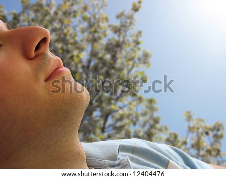 Shot of a man that looks to be sleeping - includes clipping path.  Great image for sunscreen, or skin cancer.