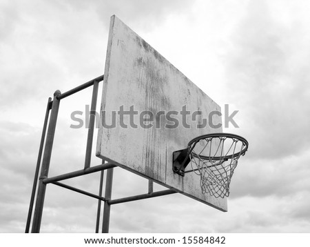 stock photo : A basketball hoop found at the park in black and white.