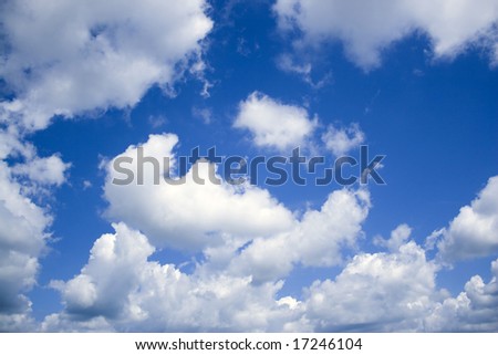 A deep blue sky and perfect cottony clouds