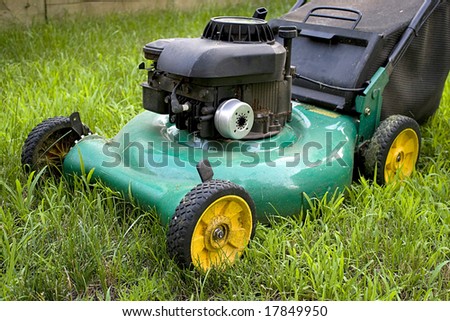 A modern lawn mower cutting through the grass.