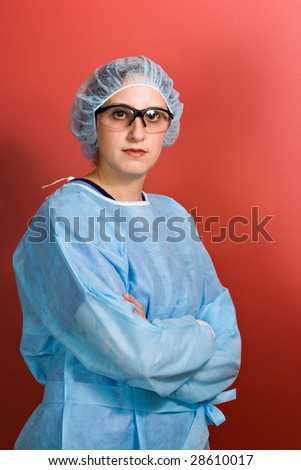 A young surgeon or nurse standing over a red background.