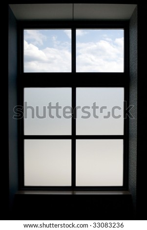 Interior view of a modern window that has frosted glass on the lower panes.