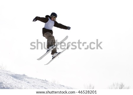 A skier catching some major air after launching off of a jump.