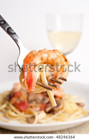 IMAGE: http://image.shutterstock.com/display_pic_with_logo/59783/59783,1268080916,3/stock-photo-a-delicious-shrimp-scampi-pasta-dish-along-with-a-glass-of-pinot-grigio-white-wine-shallow-depth-48246364.jpg