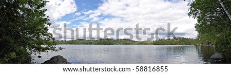 A wide angle panoramic view of the lower Saranac Lake and islands located in the upstate New York Adirondacks.