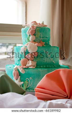stock photo A blue beach themed wedding cake with three tiers