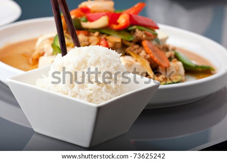 Fresh Thai food stir fry with tofu and white jasmine rice.