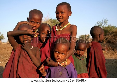 The Masaai Children. A bunch of young Masaai children from a boma in the North of Tanzania pose to the Camera. Taken at: Oldukai, Tanzania, Africa, 2009.