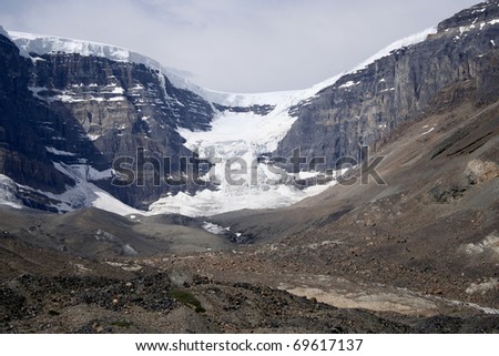 Dome Glacier. The beautiful glacier spilled over bedrock cliffs of the Canadian Rockies. Taken at Columbia Icefields, Jasper National Park, Canadian Rockies, Alberta, Canada.