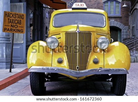 Singapore May 5, 2012: A Yellow Vintage Taxi Car .