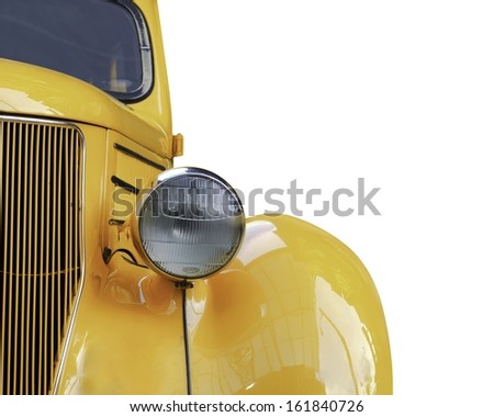 A yellow retro car headlight closeup isolated on white background.