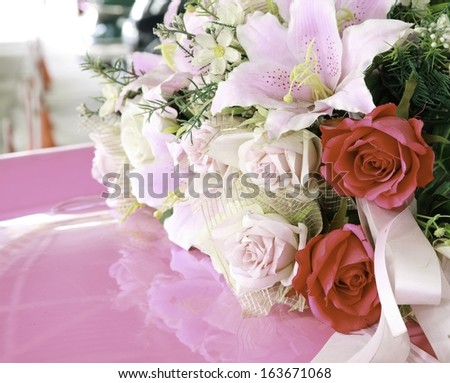 bouquet of  flowers with shadow on pink foreground.  with shadow on pink foreground.