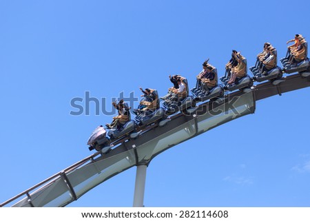 Osaka, Japan - April 22: Roller coaster in Universal Studios Theme Park in Osaka, Japan on - April 22, 2015. The theme park has many attractions based on the film industry.