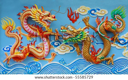 stock photo red and gold chinese dragon statue at the wall of chinese