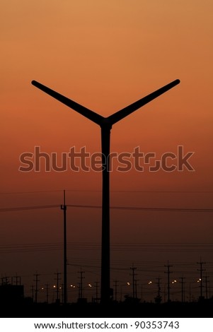 Wind turbine silhouette on twilight sky