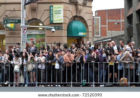 SYDNEY, AUSTRALIA - MARCH 5: Crowded people at mardi gras parade on March 5, 2011 in Oxford Street, Sydney, Australia. Mardi gras is an annual event for gay/lesbian acceptance in Sydney.