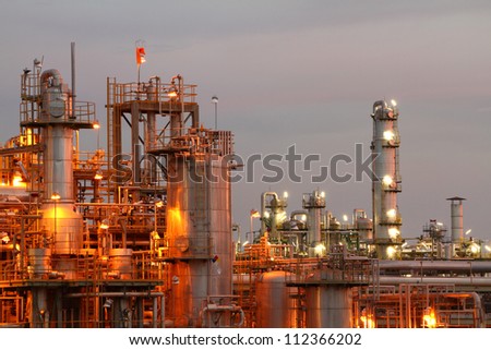 Glow light of petrochemical industry on sunset.