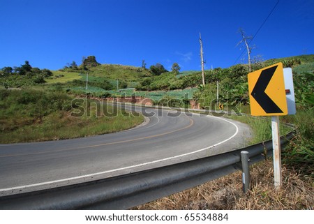 curving road sign