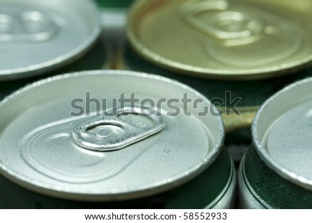 Many cans of beer with water drops