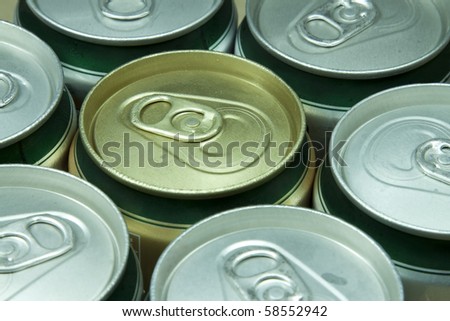 Many cans of beer with water drops