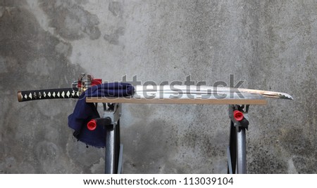 Japanese Katana Sword on a workbench for maintenance