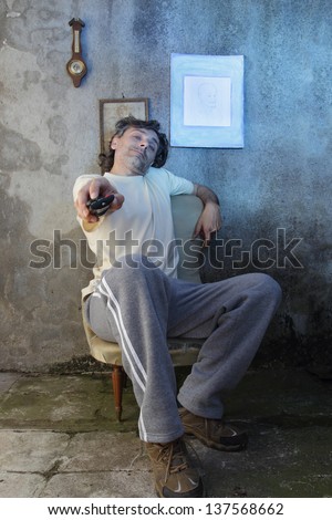 tired man with remote control