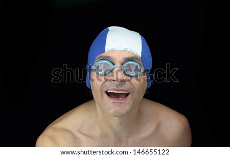 smiling swimmer over black background
