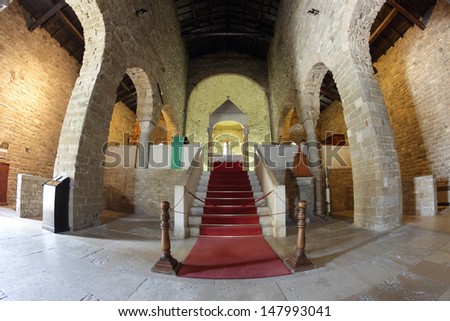 SAN LEO, ITALY - JULY 20: Romanesque interior of the Pieve church in a fish-angle view on July 20, 2013 in San Leo, Italy