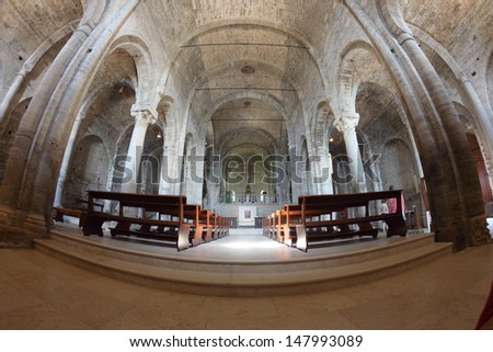 SAN LEO, ITALY - JULY 20: Romanesque interior of the Cathedral built in VII century in a fish-angle view on July 20, 2013 in San Leo, Italy