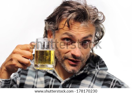 unshaven man drinking beer