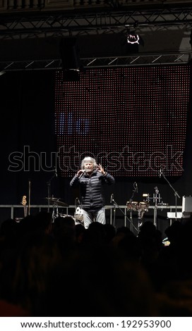 NOVARA, ITALY - MAY 14, 2014: Former comedian and M5S leader Beppe Grillo speaks at a party rally in Martiri square