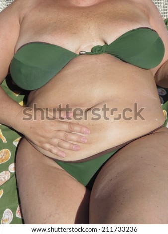middle age  over weight woman in bikini