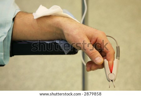 Hand of the person sleeping under a medical narcosis during operation