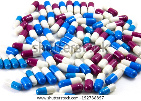 medicine cachet blue red and white