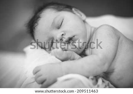 Newborn baby girl sleeping Black-white image