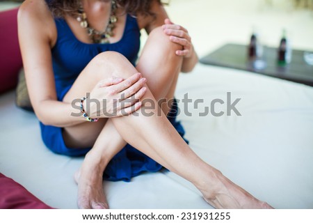 Beautiful woman legs. Young woman resting. Charming woman in a restaurant. Beautiful woman at cafe restaurant lifestyle portrait, summer vacation of sexy young girl.