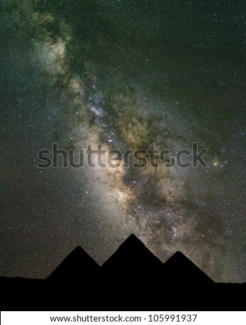 The Milky Way rises over the Pyramids in Egypt. Image large enough to crop horizontally.
