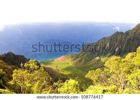 The Kalalau Valley on the Na Pali coast on the Hawaiian island of Kauai. Fades to white.
