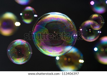 Many party soap bubbles isolated on black. Extremely detailed.