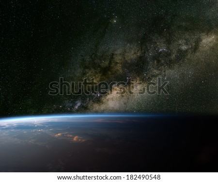 The Milky Way over planet Earth. Elements of this image furnished by NASA.