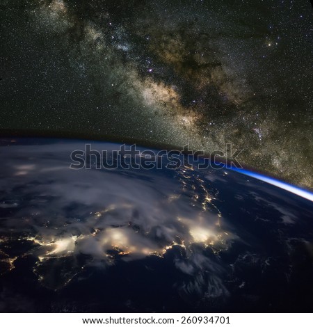 Japan at night from space with the Milky Way above. Elements of this image furnished by NASA.